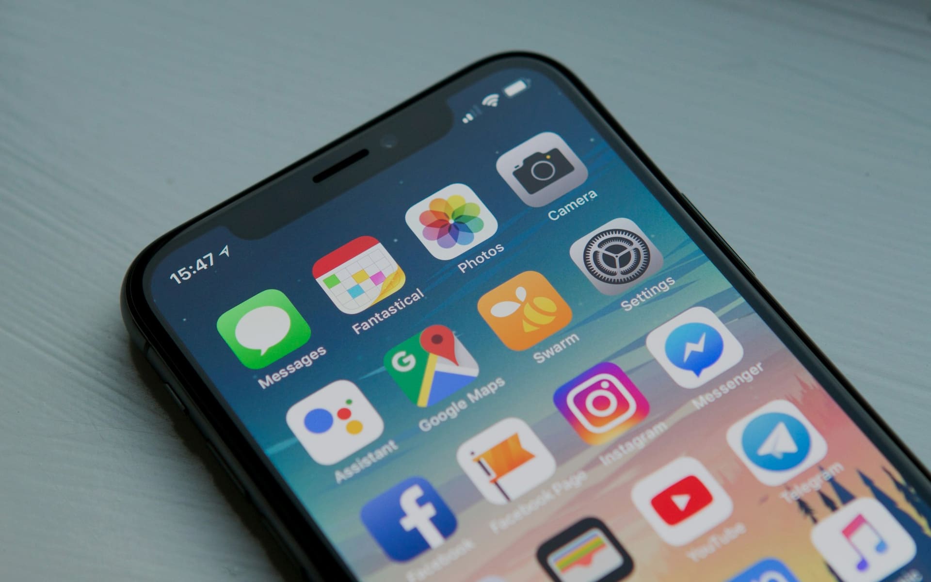 Smartphone showing a mobile app interface in low ambient light